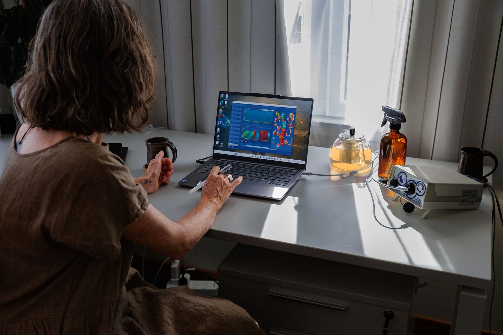 Caroline working with the ATM Express software at her desk